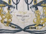a picture of a close up of a scarf with horses on it