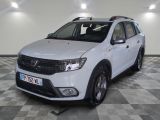 a picture of a white dacia parked in a garage
