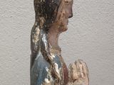 a statue of a woman holding a baby in her arms