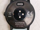 a close up of a watch on a white surface