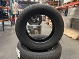 tires stacked on top of each other in a warehouse