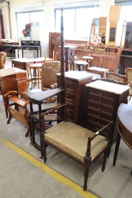 many chairs and tables in a room with a lot of furniture