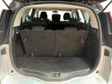 the back of a car with its trunk open and seats folded down
