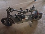 a scooter that is sitting on the floor in the room