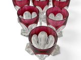 a lot of wine glasses that are sitting on a table
