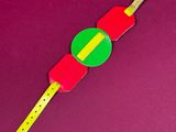 a red and green object on a yellow and green object