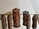 many different types of vases sitting on a table