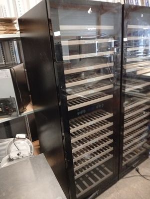 a refrigerator that has a lot of wine in it