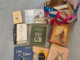 a bag full of books on the floor next to a bag of books