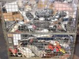 a metal cart with many items in it in a warehouse