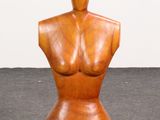 an image of a wooden mannequin sitting on top of a floor