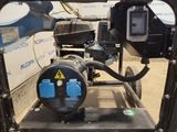 a machine that is sitting on a stand in a room