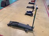 a long line of luggage on the floor of a building