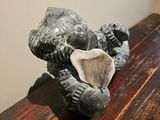 a small statue of a bear on a wooden table