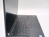 a laptop with a black keyboard on a white surface
