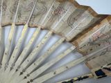 a close up of a fan on a table