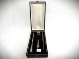 a black box with a silver spoon and a fork in it