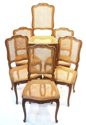six chairs and a stool are arranged in a circle on a white background