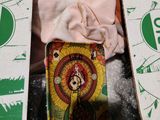 a doll in a box that is sitting on the floor