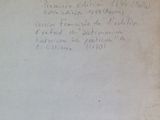 a piece of paper with writing on it sitting on top of a table
