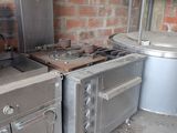 two ovens and a stove in a kitchen