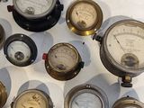 many different types of gauges displayed on a table