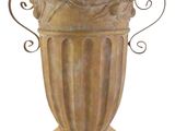 a large vase with a bird on it on a pedestal