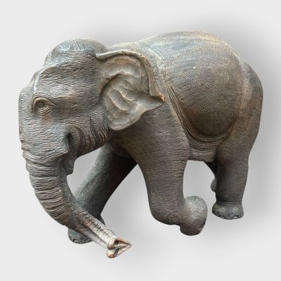 a statue of an elephant that is standing on its hind legs