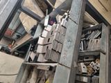a pile of metal items on a shelf in a room