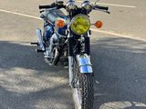 a motorcycle that is parked on the side of the road