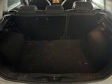 a trunk of a car with the back seats folded down
