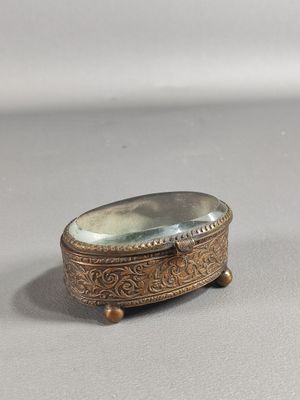 an antique silver plated box with a mirror in the middle of it