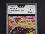 a close up of a pokemon trading card on a black surface
