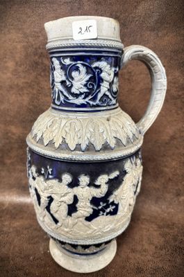 a blue and white vase sitting on a brown surface