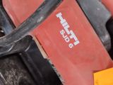 a close up of a red box with a black handle