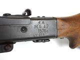 a close up of a rifle on a white surface with a white background