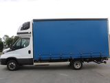 a picture of a blue and white truck parked in a parking lot