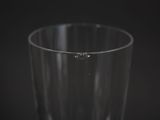 a close up of a glass of water on a black background