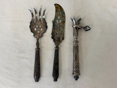 two knives and a knife holder on a table