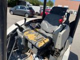 an image of a tractor seat in the back of a truck