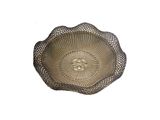 a wicker basket with a flower design on it
