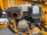 a close up of a small engine on a construction vehicle