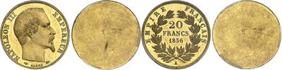 a close up of four different types of coins on a white background
