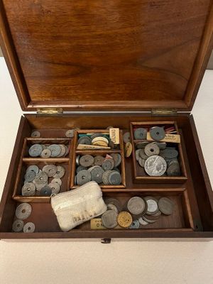 a wooden box filled with lots of different types of buttons
