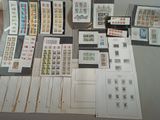 a lot of stamps on a table with a pair of scissors