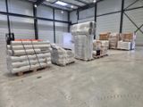 a large warehouse filled with lots of boxes and pallets