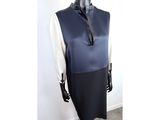the mannequin is wearing a black and white dress with a black tie