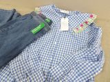 blue and white gingham shirt and jeans on a cardboard box