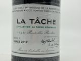 a bottle of wine that is sitting on a table