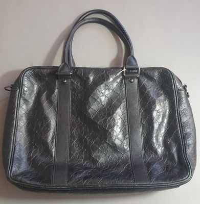 Christian Lacroix. Sac en cuir teinté noir monogrammé, à deu…